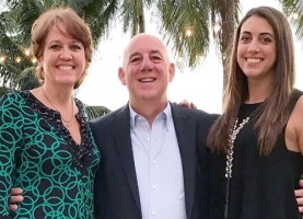 Caitlin Dechelle with her parents