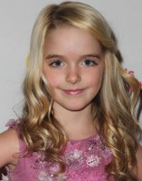 Mckenna Grace in her curly blond hair