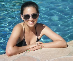 Molly Ephraim in the swimming pool wearing bikini